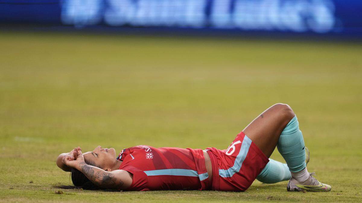 Kansas City Current midfielder Debinha takes a moment before getting back to her feet during Racing Louisville’s 2-0 victory at Children’s Mercy Park on Saturday.