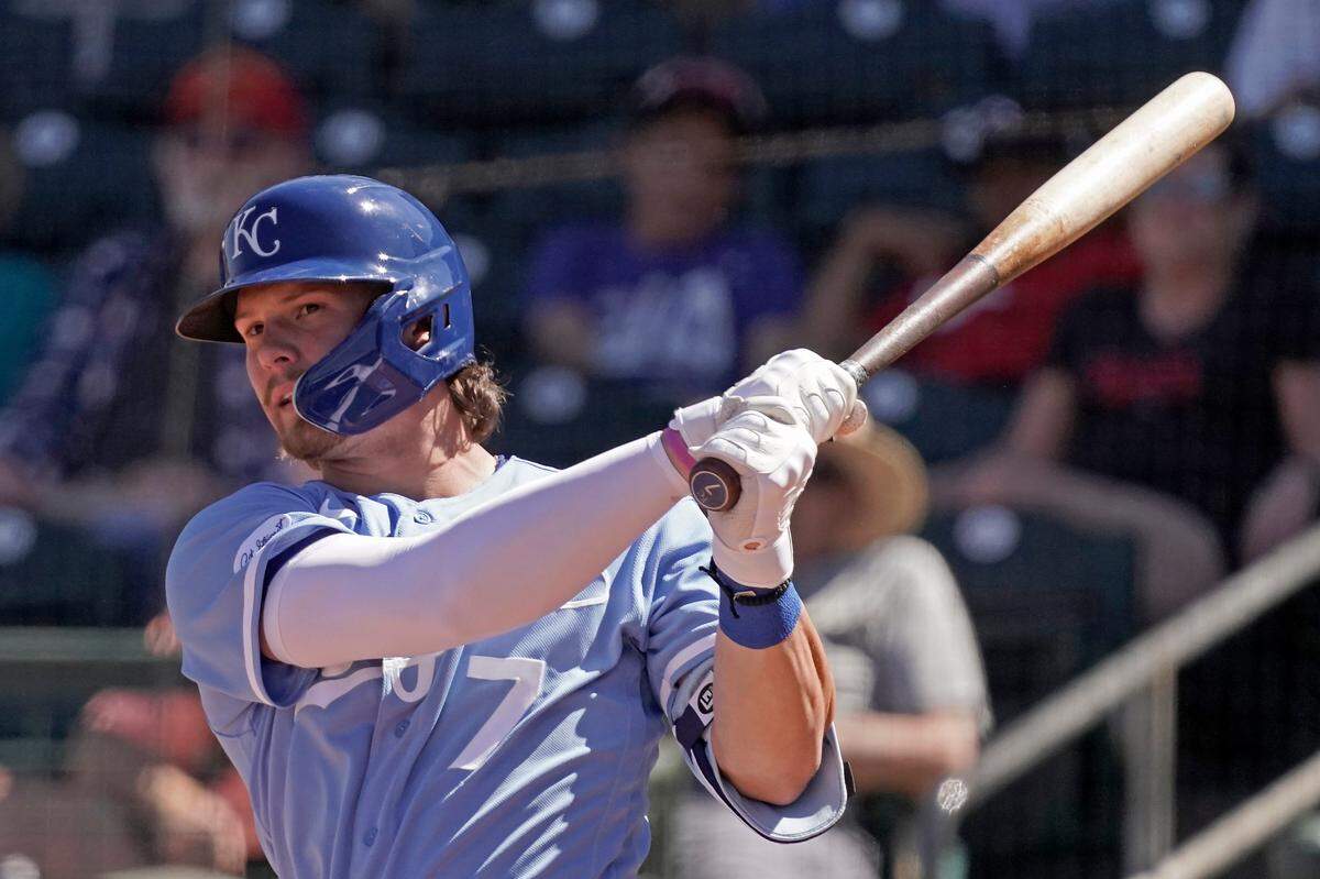 Kansas City Royals infielder Bobby Witt Jr. watches the trajectory of a hard-hit single during a spring training game against the Cincinnati Reds in Surprise, Ariz.