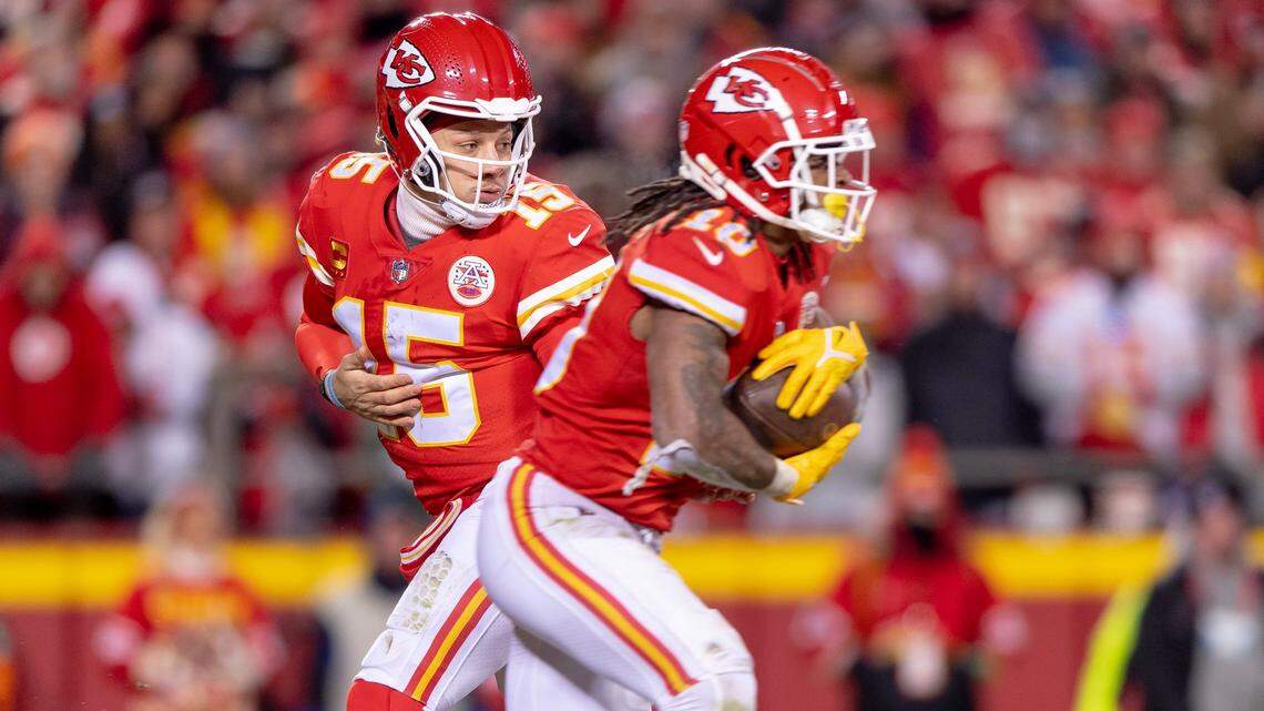 Kansas City Chiefs quarterback Patrick Mahomes hands the ball off to running back Isiah Pacheco during the AFC Championship Game at GEHA Field at Arrowhead Stadium on Sunday, Jan. 29, 2023.