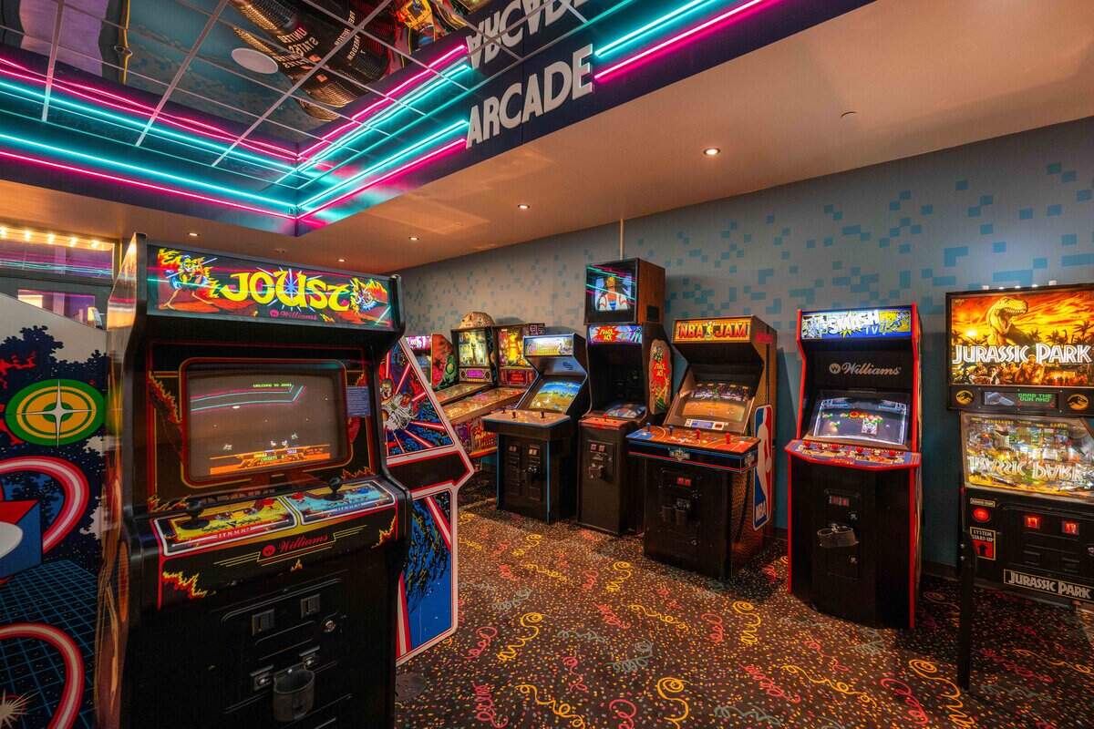An arcade inside of Atlas 9, on Wednesday, Sep. 3, 2025, in Kansas City, Kansas. Designed by Kansas City-based industrial design company, Dimensional Innovations, Atlas 9 is a narrative-driven immersive art experience featuring interactive games, videos, and AI-powered experiences.