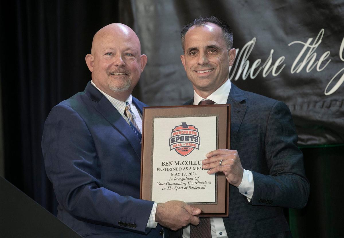 Inductee Ben McCollum received his plaque from Byron Shive, CEO of the Missouri Sports Hall of Fame, during the enshrinement ceremony Sunday, May 19, 2024, at Union Station.