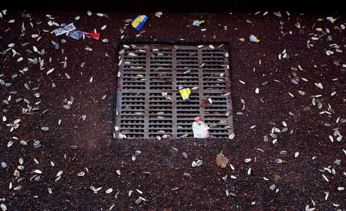 Shells of sunflower seeds and bubble gum wrappers litter the Kansas City Royals’ dugout floor after the Royals’ home opener against the Minnesota Twins Thursday at Kauffman Stadium.