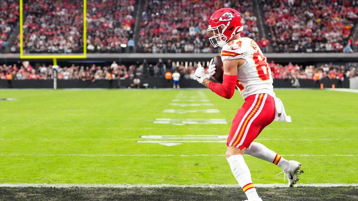 Kansas City Chiefs wide receiver Justin Watson (84) catches a touchdown pass against the Las Vegas Raiders during the second quarter at Allegiant Stadium.