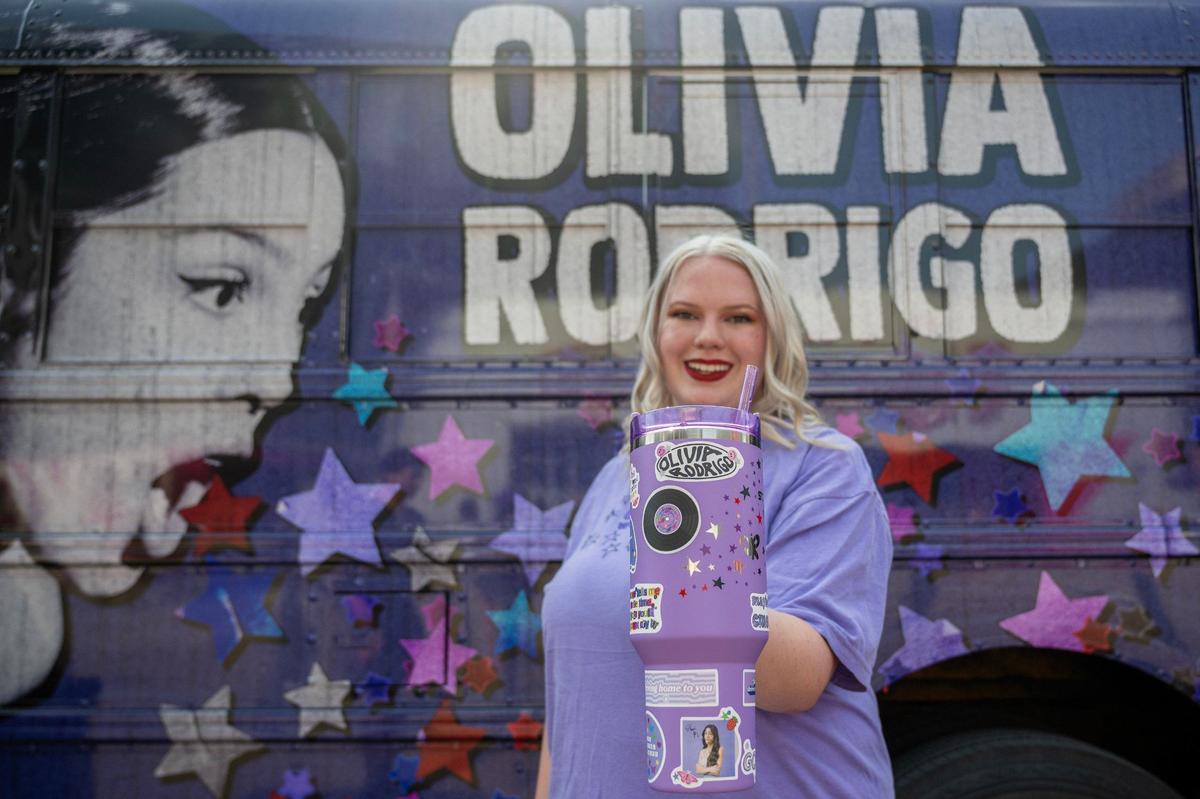 Brooklin Hall shows off her Olivia Rodrigo-themed Stanley cup before the Olivia Rodrigo Guts World Tour concert at T-Mobile Center on Friday.