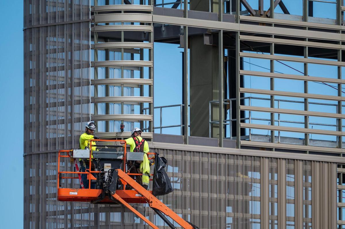 Crews worked on a massive new scoreboard on Wednesday, Feb. 26, 2025, at the University of Kansas in Lawrence. The scoreboard is two-and-a-half times larger than the previous scoreboard and is approximately 60 feet closer to the field.