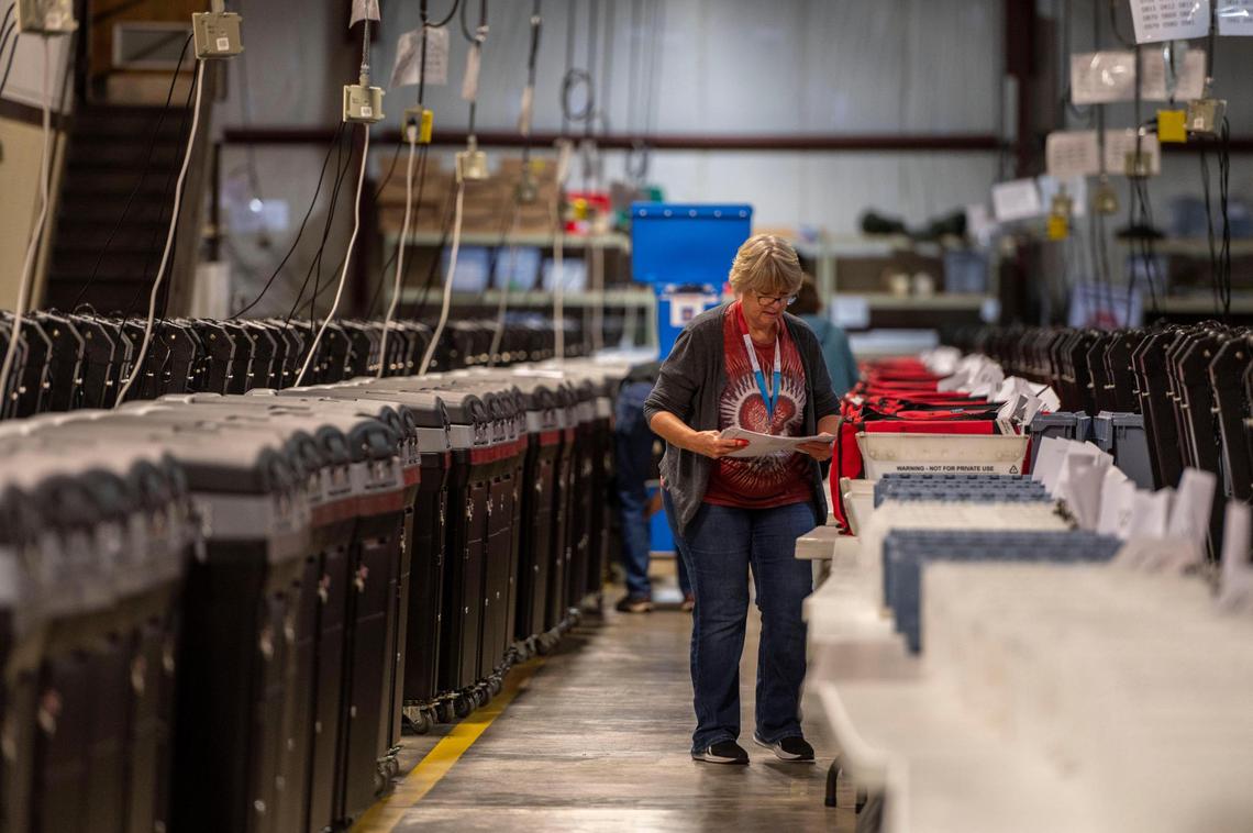 Election workers sort out voter ballots into plastic bins at the Johnson County Election Office on Tuesday, Aug. 16, 2022, in Olathe. Kansas’ largest counties will undergo a recount of ballots from the August 2, election in an attempt by Value Them Both supporters to overturn the state’s vote in favor of abortion rights.