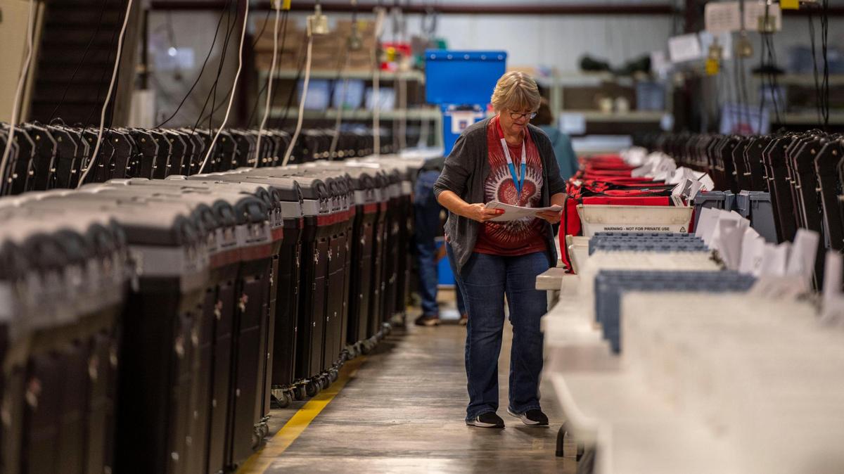 Election workers sort out voter ballots into plastic bins at the Johnson County Election Office on Tuesday, Aug. 16, 2022, in Olathe. Kansas’ largest counties will undergo a recount of ballots from the August 2, election in an attempt by Value Them Both supporters to overturn the state’s vote in favor of abortion rights.