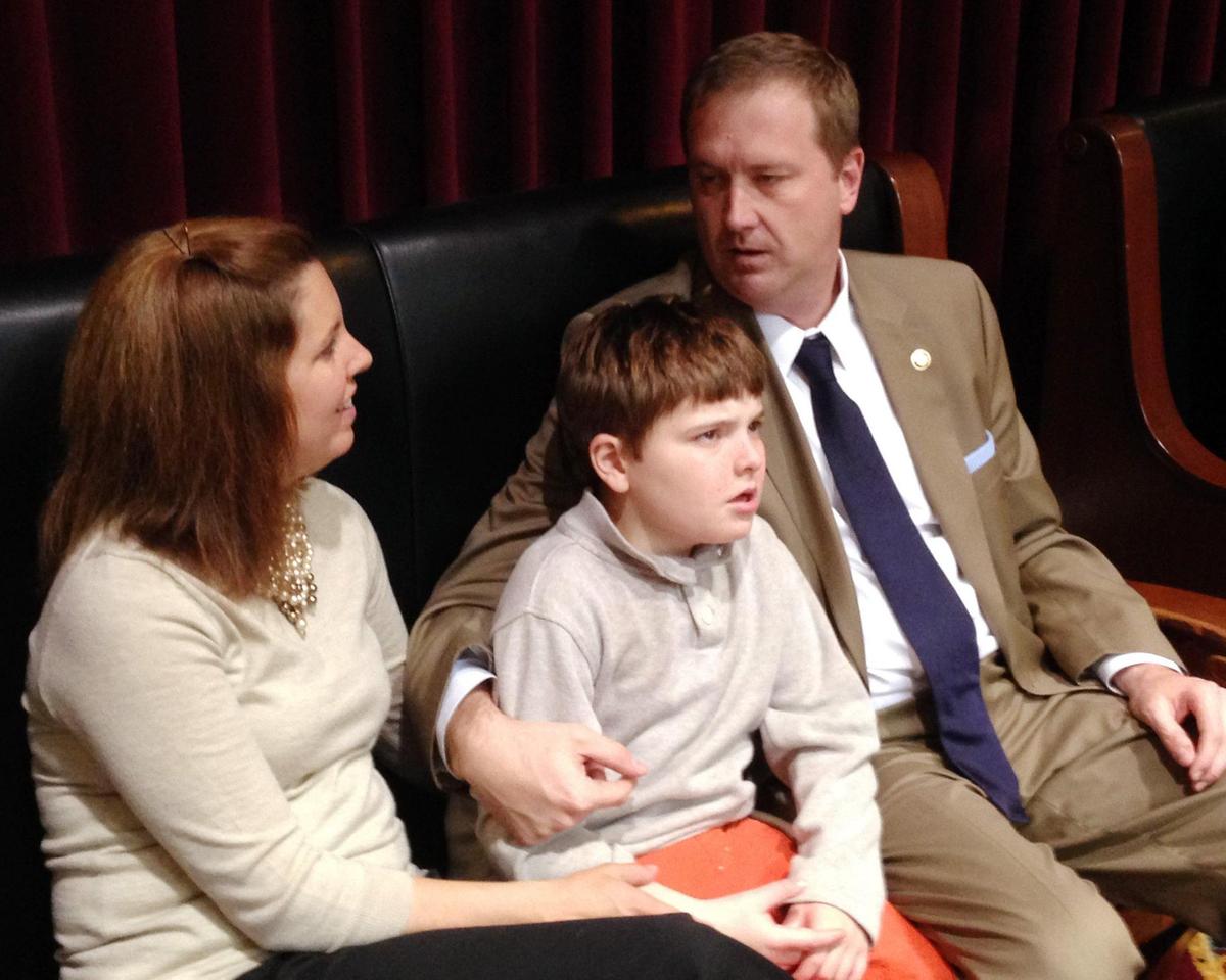 Then Republican Missouri Sen. Eric Schmitt, his wife Jaime, and their son Stephen watch a state House debate in Jefferson City in 2014 where lawmakers discussed a bill that would allow the use of CBD oil to help calm seizures in people with epilepsy and other medical conditions. On the Senate floor, Schmitt drew upon his family’s experience in asking for support for the bill, describing the frightening seizures his non-verbal son suffered