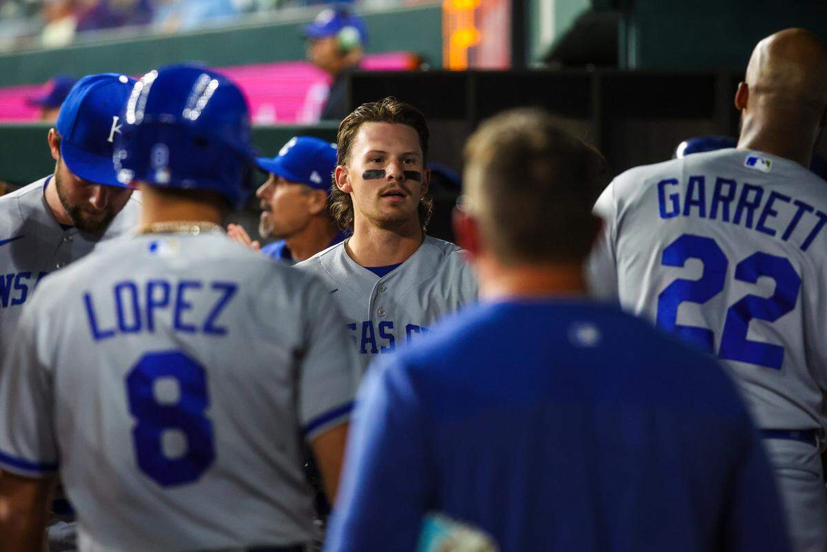 Kansas City Royals shortstop Bobby Witt Jr. (7) celebrates with teammates after scoring during the eighth inning against the Texas Rangers at Globe Life Field on April 11, 2023