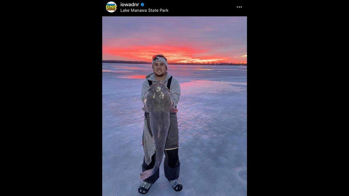 Ice angler Gavin Campbell with a 40-inch, 34-pound flathead catfish.