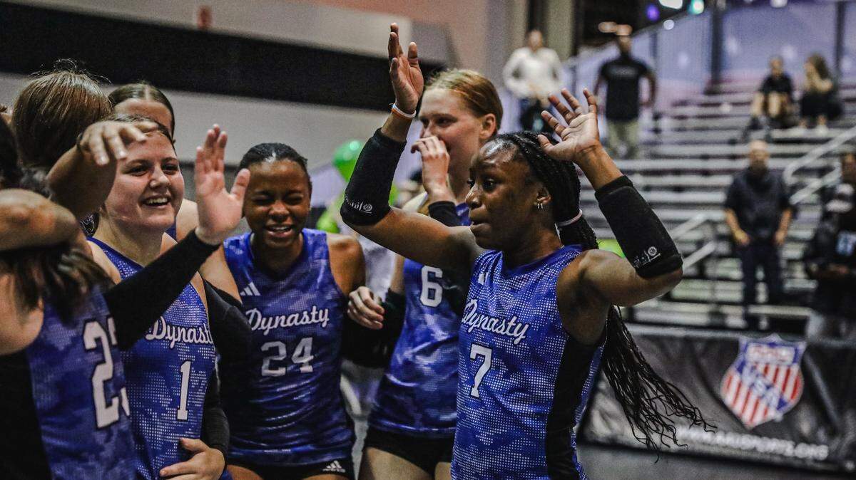 Dyansty 14 Black, a Kansas City-based junior volleyball team, celebrates a win during the AAU’s annual Junior National Volleyball Championships in Orlando, Florida.