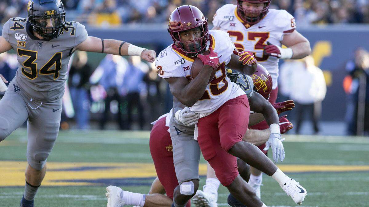 Iowa State running back Breece Hall escapes the tackle of West Virginia defenders during an Oct. 12 game. He’s a former star at Wichita Northwest.