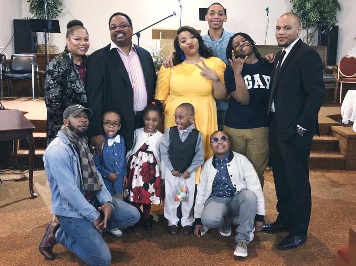 Bishop Frank Douglas Jr. and his wife with nine of their children.