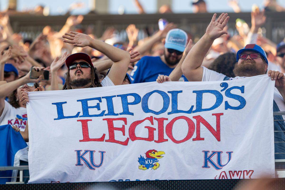 Fans hold up a sign in support of Jayhawks head coach Lance Leipold inside David Booth Kansas Memorial Stadium prior to the Jayhawks game vs. the Fresno State Bulldogs on Saturday, Aug. 23, 2025, in Kansas City.