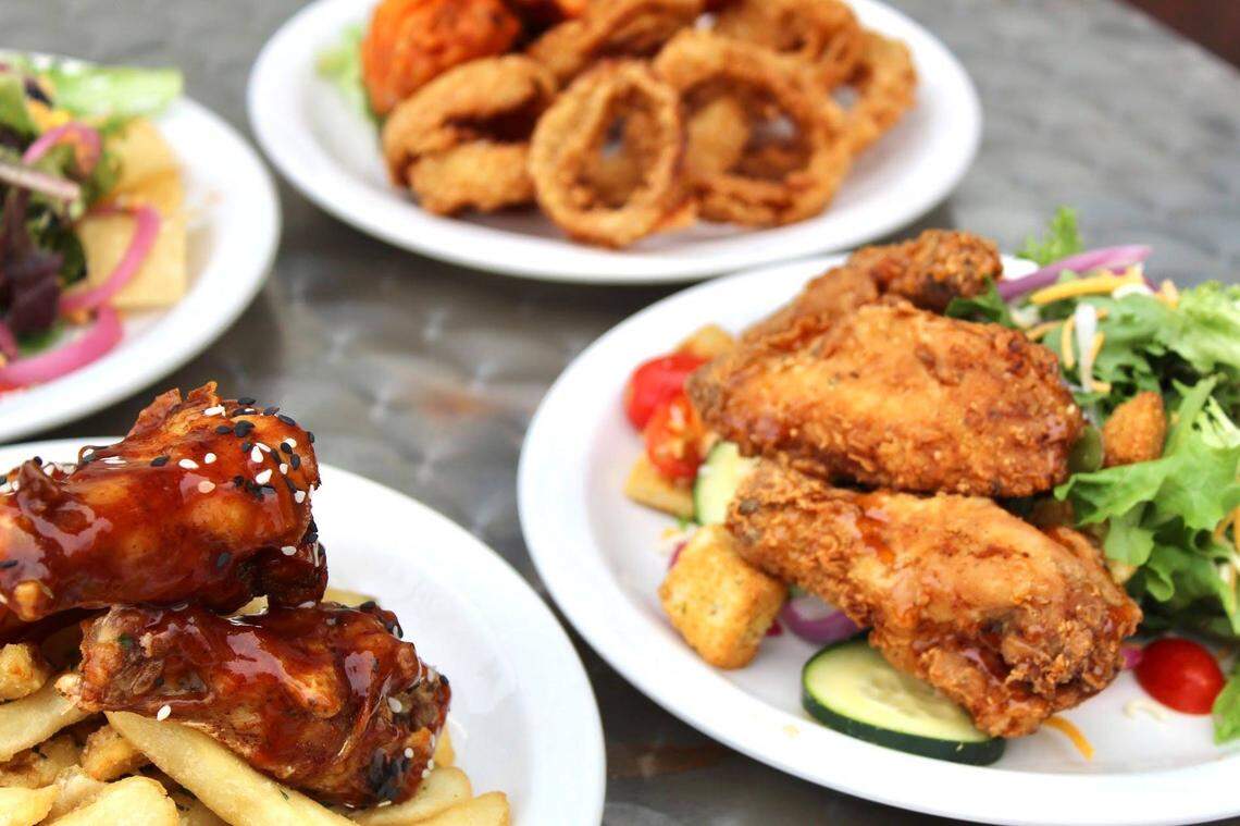 Johnny Wings offers wings with a choice of sauces, garlic cheese curds, fries, sweet potato fries, truffle fries, tater tots, spicy cauliflower, salads and dessert waffles.