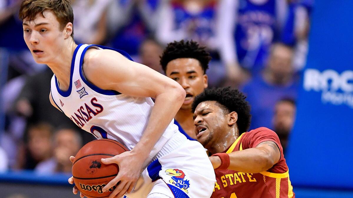 KU’s Christian Braun, left, steals the ball from ISU’s Prentiss Nixon during the first half of Monday night’s Big 12 Conference game at Allen Fieldhouse.