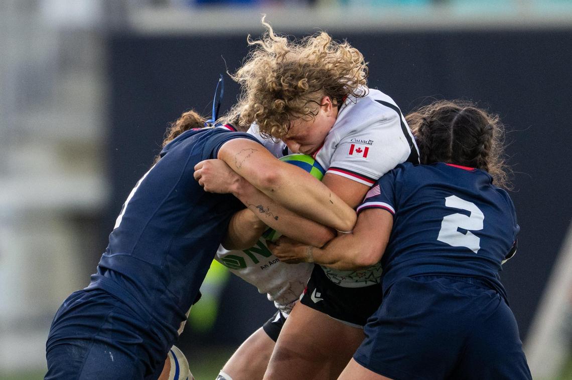 Team USA players gang tackle a Canadian player with the ball in the USA vs. Canada rugby match at CPKC Stadium on Friday, May 2, 2025. Canada won the match 26-14.