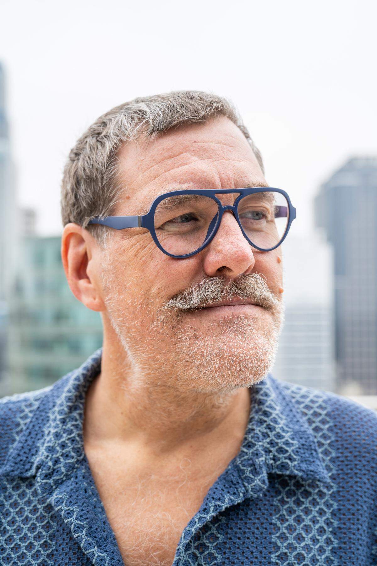 Kris Saim outside his home on Friday, April 10, in Kansas City. Saim has Stage 4 terminal cancer and is recording a podcast, Dying Out Loud, that talks about death. Saim's aim is to provide an avenue for people that want to confront the reality of death.