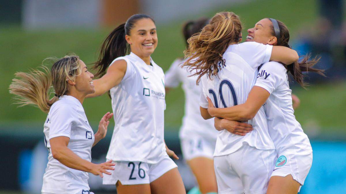 Kristen Edmonds embraces Kansas City National Women’s Soccer League teammate Mallory Weber after Weber put KC NWSL up 1-0 in the seventh minute in a Challenge Cup match against OL Reign at Legends Field in Kansas City, Kansas on May 3, 2021. KC lost 2-1.