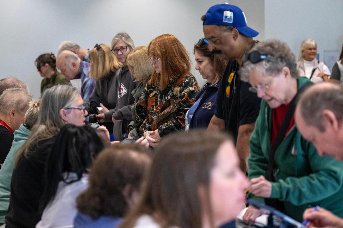 Within minutes of the doors opening, election workers were helping a large turnout of Johnson County residents arriving for the first day of in-person advance voting for the 2024 General Election at The Arts and Heritage Center in Overland Park on Saturday, October 19.