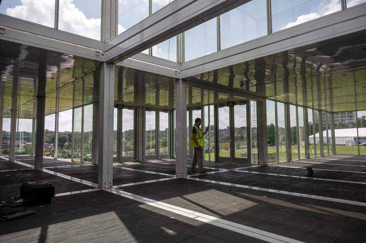 A member of the media walks through a partially constructed hospitality space at the FIFA Fan Festival site during a media walkthrough at the National WWI Museum and Memorial on Wednesday, May 27, 2026, in Kansas City.