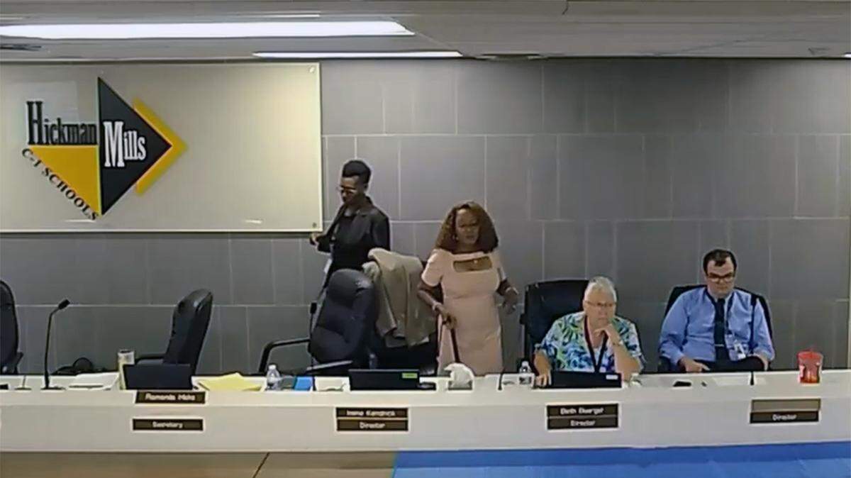 Participants in a Hickman Mills school district board meeting May 25, 2023