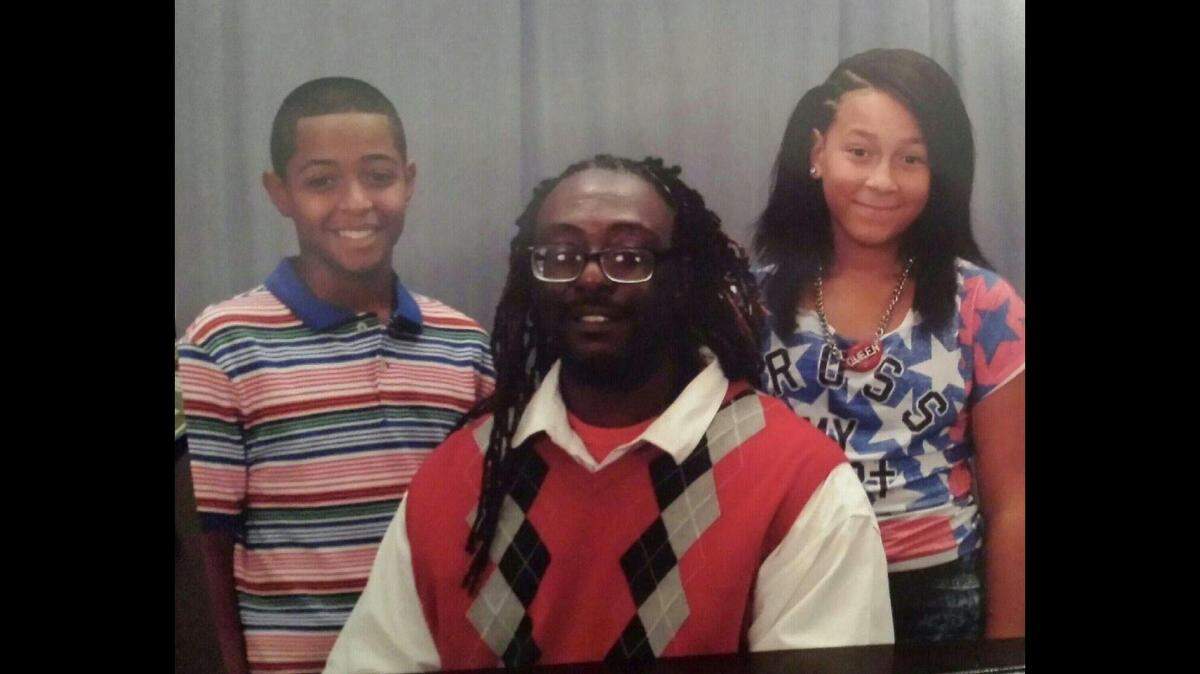 Christopher McIntyre with two of his children.