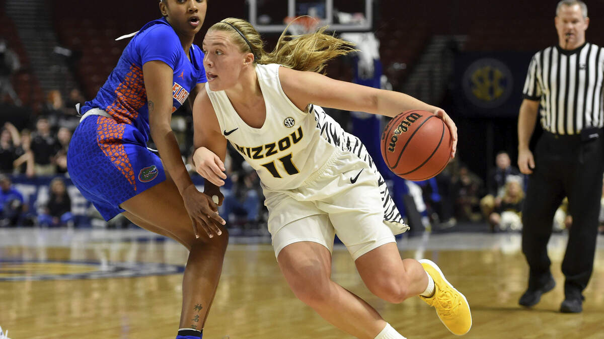 Missouri’s Haley Troup (11) drives past Florida’s Danielle Rainey during the first half of an NCAA college basketball game at the Southeastern Conference women’s tournament, Thursday, March 7, 2019, in Greenville, S.C. (AP Photo/Richard Shiro)