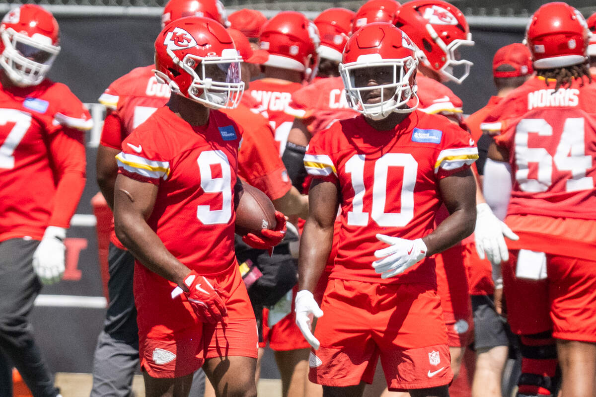 Kansas City Chiefs running back Kenneth Walker breaks down a drill with rookie running back Emmett Johnson on the first day of minicamp, Tuesday, June 9, 2026, in Kansas City.