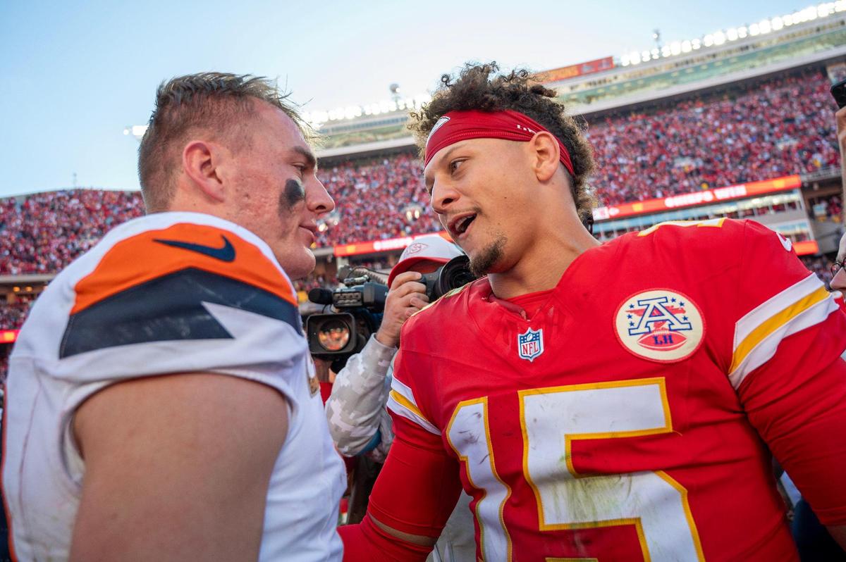 Kansas City Chiefs quarterback Patrick Mahomes (15) embraces Denver Broncos quarterback Bo Nix (10) following the Chiefs’ 16-14 victory over the Broncos during an NFL game on Sunday, Nov. 10, 2024, at GEHA Field at Arrowhead Stadium.