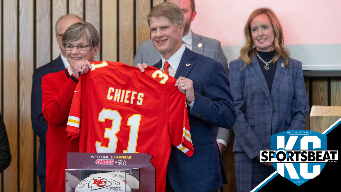 Kansas Governor Laura Kelly announced Monday, Dec. 22, 2025, in Topeka that the Kansas City Chiefs will build their new stadium in Kansas City, Kansas. Kelly presented Chiefs CEO Clark Hunt with a football and a jersey as others looked on during the announcement.