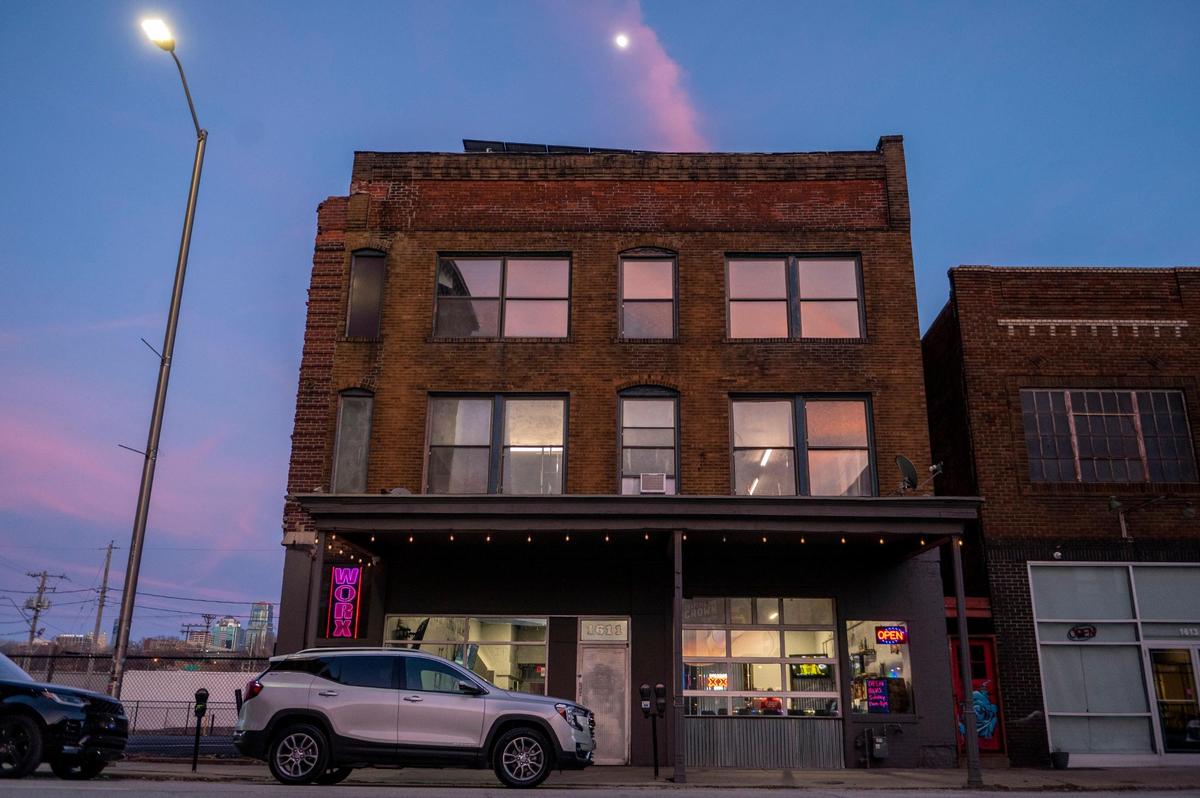Lights flicker outside of Savage Saloon in the West Bottoms.