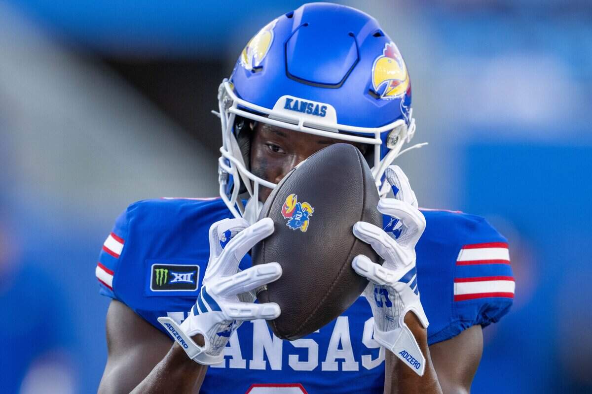 Kansas Jayhawks wide receiver Nahzae Cox (0) catches the ball in warmups before the Jayhawks game vs. Long Island University Sharks at David Booth Memorial Stadium on Friday, September 4, 2026, in Lawrence.