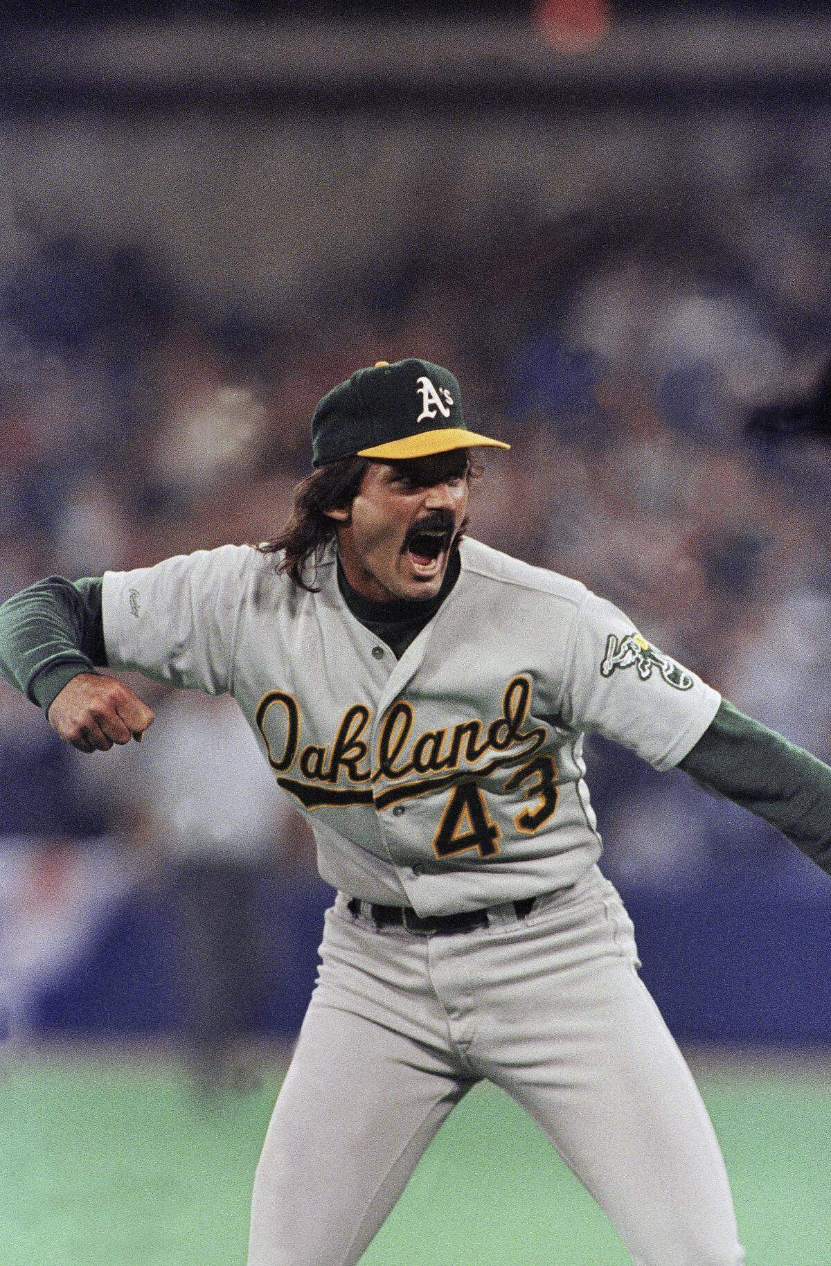 Oakland A?s reliever Dennis Eckersley lets out with a yell in the bottom of the ninth inning as Oakland beats the Toronto Blues Jays 6-5 in the fourth game of their American League Championship Series in Toronto on Saturday, Oct. 7, 1989. Oakland now leads the series three games to one. (AP Photo/Mark Duncan)