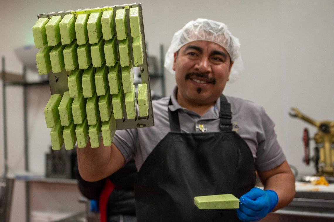 Hugo Márquez shows off the pistachio paletas he made using a mold at the Palacana factory in Roeland Park.