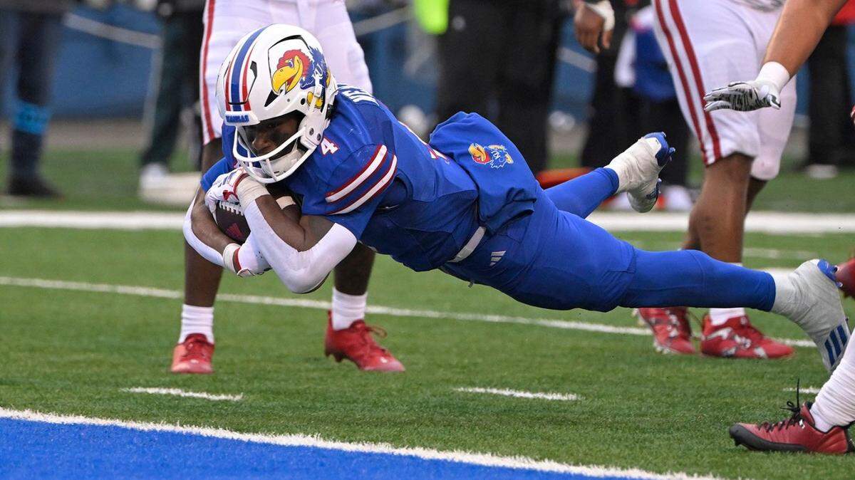 KU running back Devin Neal dives into the end zone for the go-ahead touchdown against Oklahoma during last weekend’s game at David Booth Memorial Stadium.