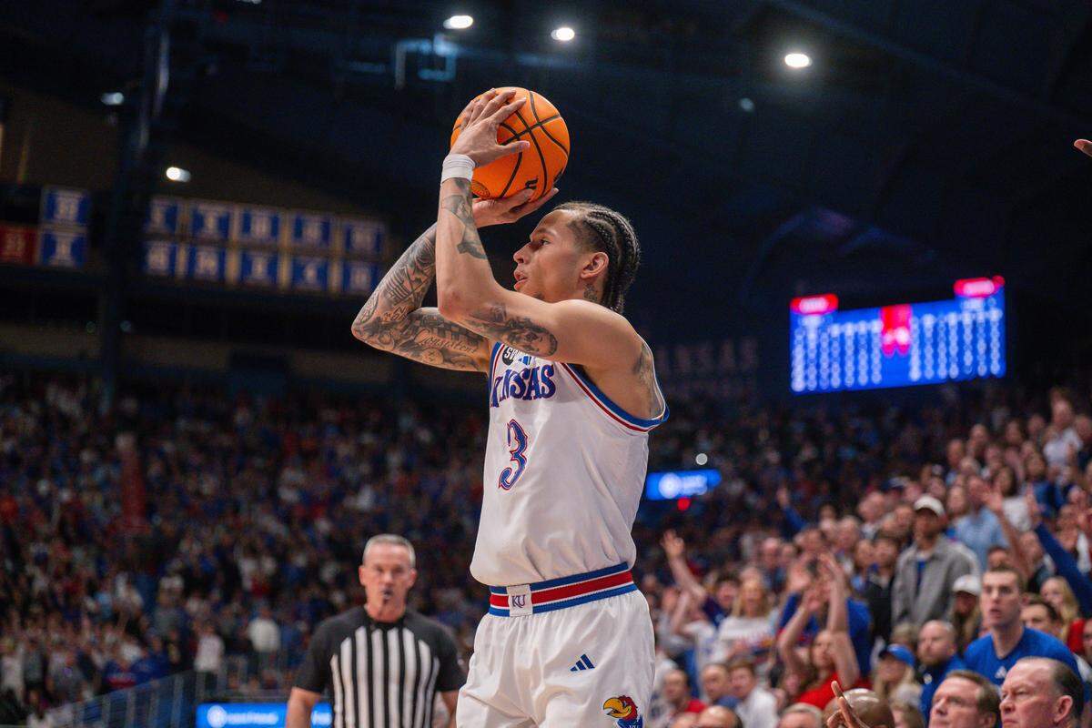 Kansas Jayhawks guard Tre White (3) shoots a three pointer in the second half of the Jayhawks game vs. the Houston Cougars on Monday, February 23, 2026, at Allen Fieldhouse.