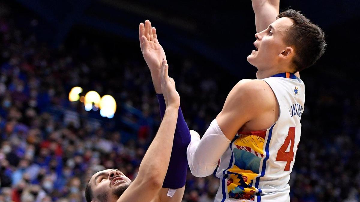 KU’s Mitch Lightfoot hits a hook over KSU’s Ismael Massoud on Tuesday at Allen Fieldhouse. KU beat KSU 102-83.
