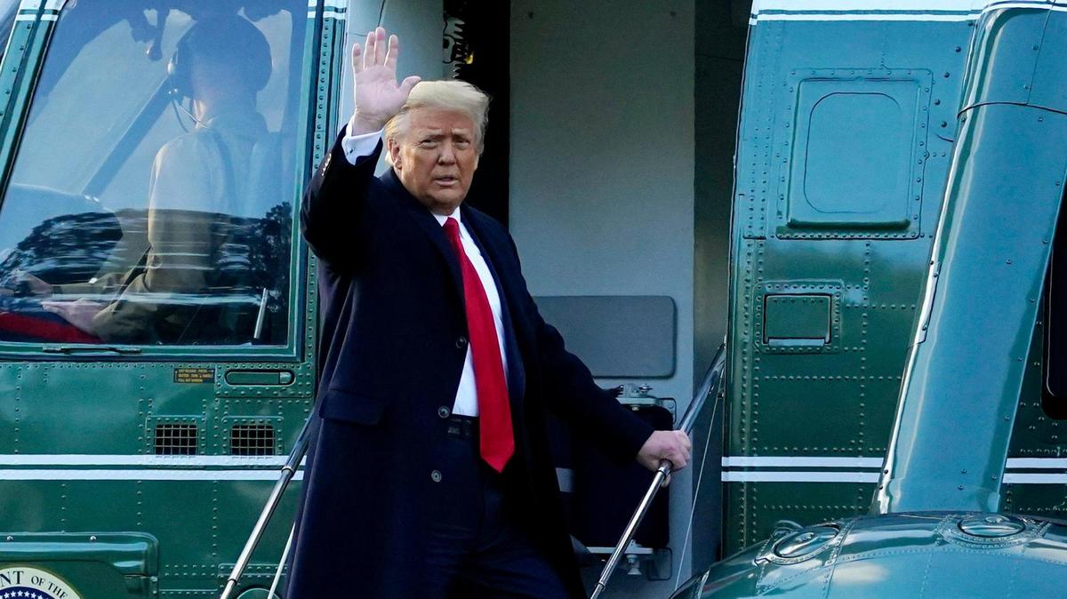 Former President Donald Trump waves as he boards Marine One on the South Lawn of the White House, Wednesday, Jan. 20, 2021, in Washington.
