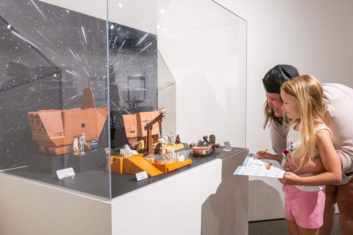 Brittany Sepulveda and Rose Martin, 6, of St. Louis, look at a vintage Star Wars toys scene at the National Museum of Toys and Miniatures on Wednesday, Aug. 13, 2025, in Kansas City.