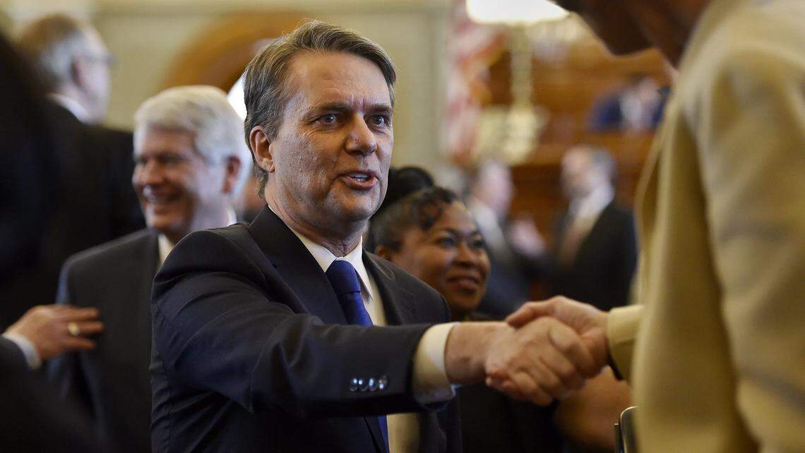 Gov. Jeff Colyer on Monday signed a transparency measure into law. In this file photo, he shakes hands with lawmakers after giving his first joint address to the Kansas Legislature on Feb. 7, 2018.