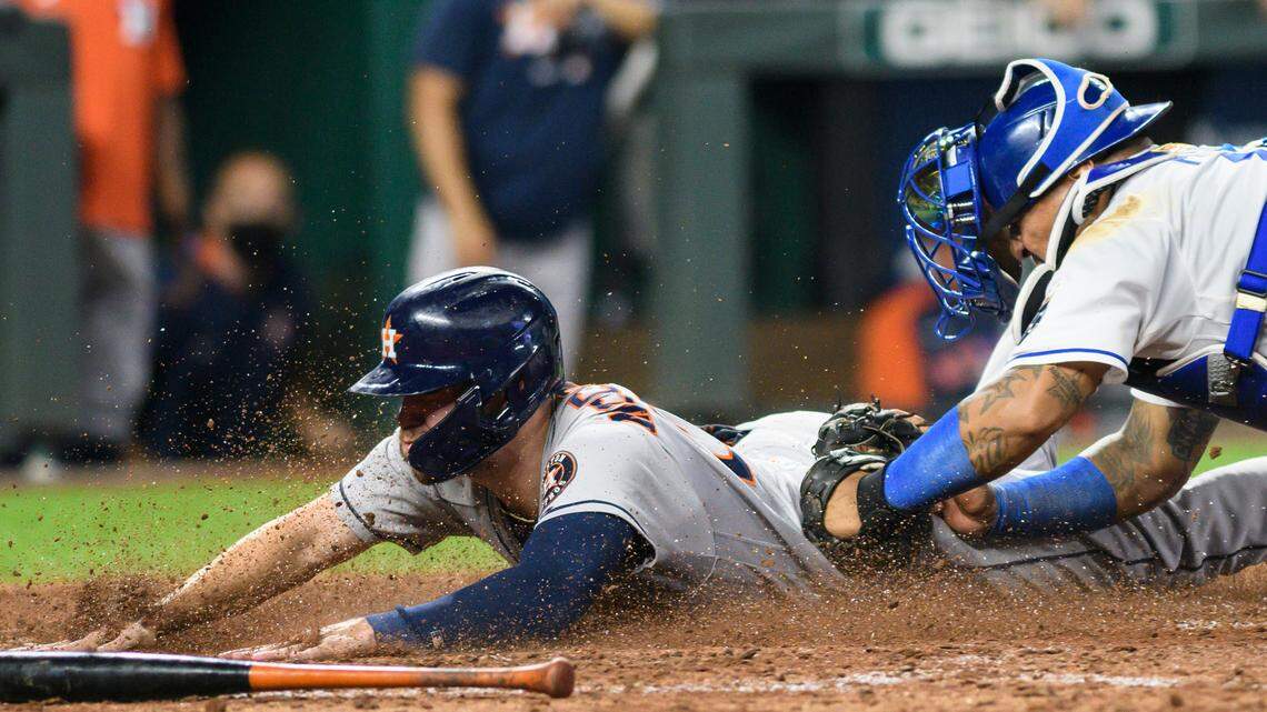 Houston Astros’ Chas McCormick, left, is tagged out by Kansas City Royals catcher Salvador Perez to end the baseball game Wednesday, Aug. 18, 2021, in Kansas City, Mo. (AP Photo/Reed Hoffmann)