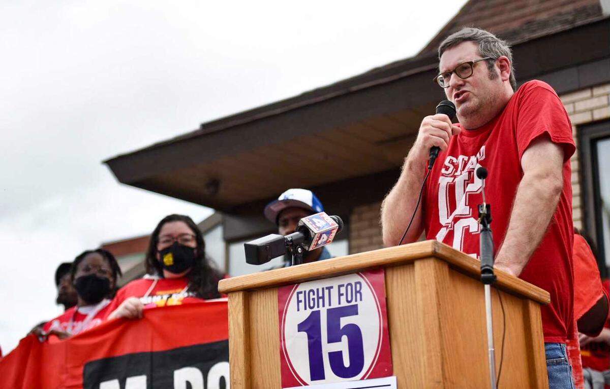 Roughly 100 people gathered to demand union rights and a $15 minimum wage for fast food workers at a McDonald’s on Main Street in Kansas City.