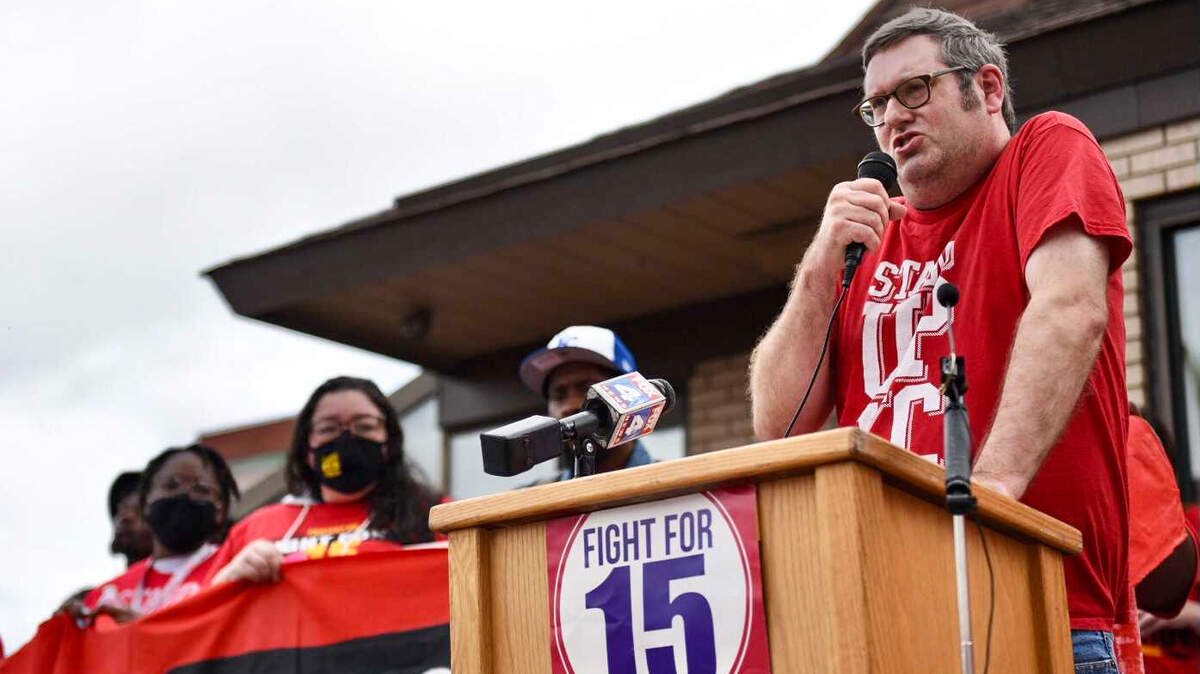 McDonald’s employee Richard Eiker, 52, speaks to a crowd of roughly 100 people gathered Wednesday, May 19, 2021, to demand union rights and a $15 minimum wage for fast food workers at a McDonald’s on Main Street in Kansas City. A new national report found that workers in Wichita would benefit from a $15 minimum wage more than in other cities.