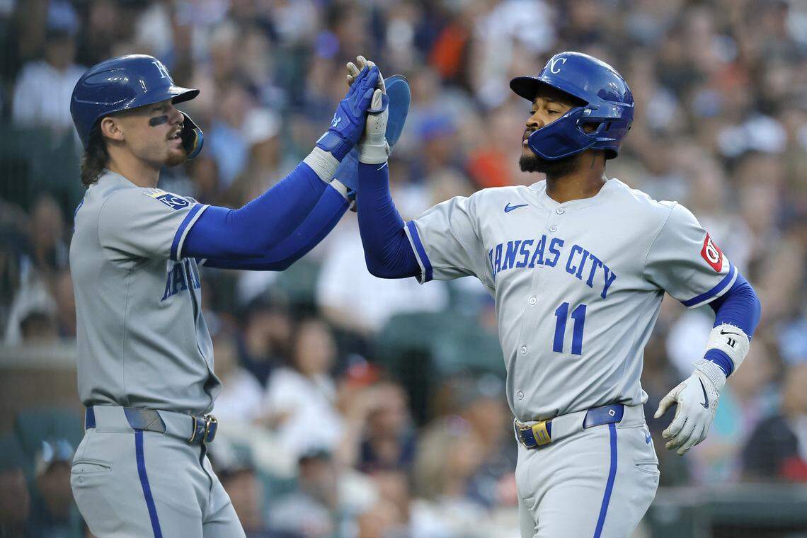 Royals shortstop Bobby Witt Jr., left, celebrates with third baseman Maikel Garcia after both scored against the Tigers during an Aug. 22, 2025 game in Detroit