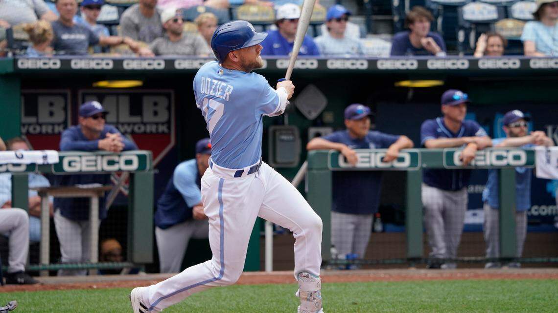 Kansas City Royals’ Hunter Dozier hits an RBI-single in the seventh inning against the Tampa Bay Rays during a baseball game Sunday, July 24, 2022, in Kansas City, Mo. (AP Photo/Ed Zurga)