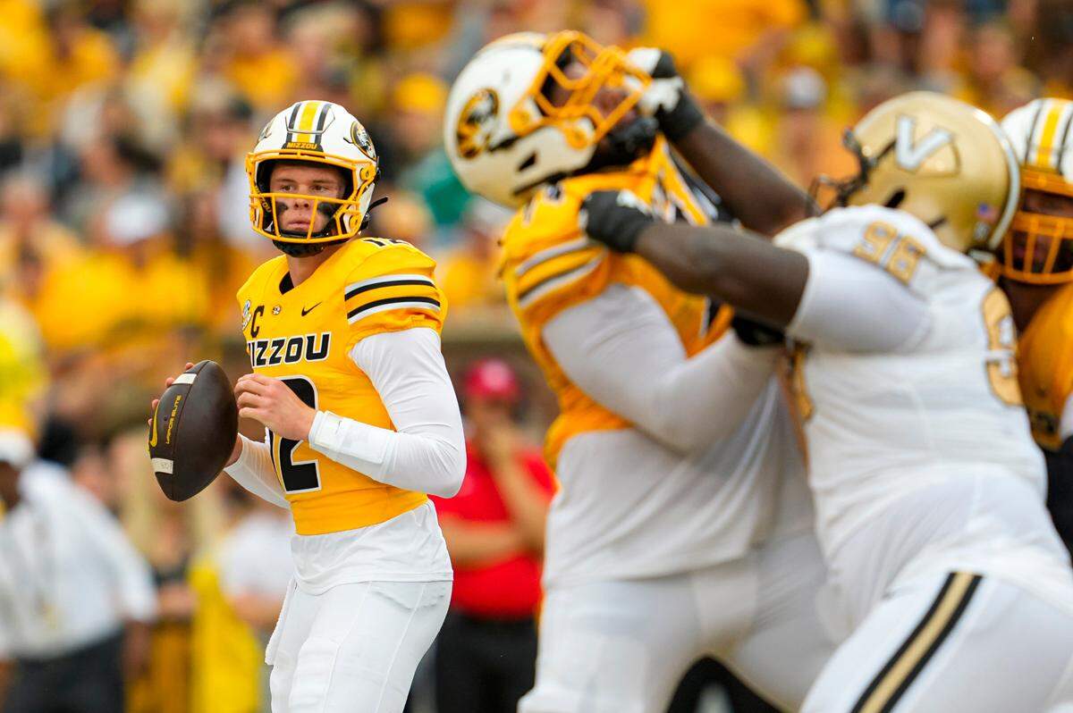 Missouri Tigers quarterback Brady Cook (12) drops back to pass during the first half against the Vanderbilt Commodores at Faurot Field at Memorial Stadium on Sept. 21, 2024.