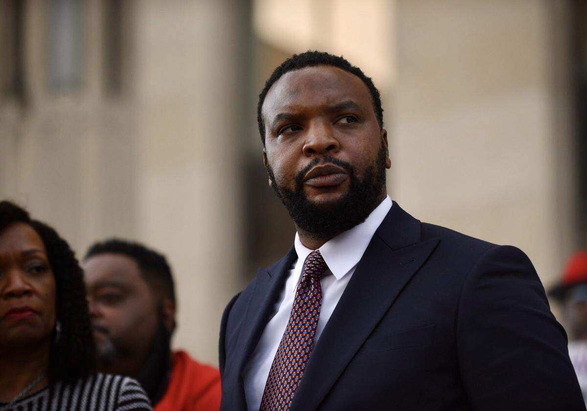 Texas civil rights attorney Lee Merritt speaks outside the Jackson County Courthouse on Monday, Nov. 8, 2021, during the trial of Eric DeValkenaere, who is charged with first-degree involuntary manslaughter and armed criminal action in the killing of Lamb, 26, on Dec. 3, 2019.