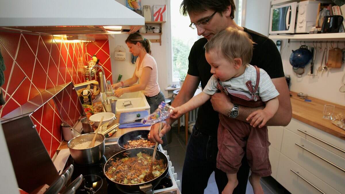 Cooking in kitchen.
