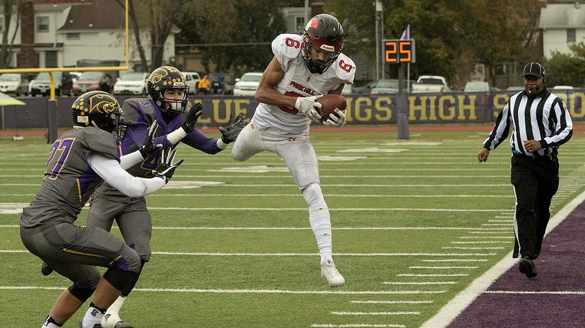 Then playing for Park Hill High, Ronnie Bell makes a catch during a 2017 high school football game against Blue Springs.
